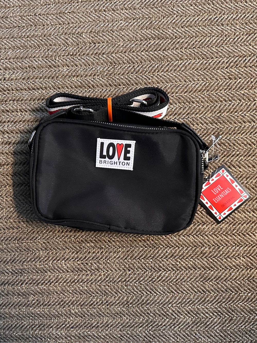 Brighton Black Crossbody Belt Bag with Red Accent Logo